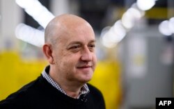 Tye Brady, chief technologist for Amazon Robotics stands in the 855,000-square-foot Amazon fulfillment center in Staten Island, one of the five boroughs of New York City, Feb. 5, 2019.