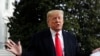 President Donald Trump talks to the media on his way to the Marine One helicopter, Nov. 20, 2019, as he leaves the White House in Washington, en route to Texas.