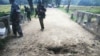 FILE - Myanmar soldiers view the crater from a landmine explosion on a bridge in Maung Nama Taung village, Nov. 12, 2016. UNICEF reported on April 3, 2024, that more than 1,000 people were killed or maimed by landmines in Myanmar in 2023.