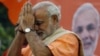 Gujarat state chief minister Narendra Modi greets supporters during the celebrations of Gujarat assembly elections in Ahmadabad, India, Dec. 20, 2012.