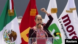 FILE - Claudia Sheinbaum of Mexico's ruling Morena party, a presidential candidate in the upcoming June 2 general election, speaks in Mexico City, Mexico, Feb. 18, 2024.