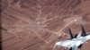 En esta imagen de un video publicado por la Fuerza Aérea de EEUU, un SU-35 ruso vuela cerca de un dron MQ-9 Reaper de la Fuerza Aérea de EEUU, el miércoles 5 de julio de 2023 sobre Siria. 