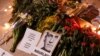 This photograph taken on Feb. 17, 2024, shows portrait placards, flowers and candles displayed as a tribute in Paris to Alexey Navalny after the announcement that the Kremlin's critic had died in an Arctic prison. China described Navalny's death as 'Russia's internal affair.'