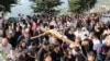 Christian worshipers take part in the Good Friday procession as they carry a cross with a Jesus Christ statue, in the town of Klayaa, southern Lebanon, March 29, 2024. 