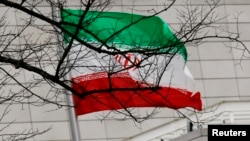 FILE - Iran's national flag is pictured at Iran's embassy in Berlin on Dec. 1, 2011. Germany said on March 20, 2024, that it had summoned the Iranian ambassador over an attempted attack on a synagogue.