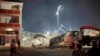 The remains of a collapsed building are seen in George, South Africa, on May 6, 2024. 