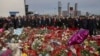 A group of ambassadors of foreign diplomatic missions attend a ceremony at a makeshift memorial in front of the Crocus City Hall on the western outskirts of Moscow, March 30, 2024.