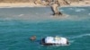 A World Central Kitchen barge loaded with food arrives off Gaza, where there is risk of famine after five months of Israel's military campaign, in this handout image released March 15, 2024. (Israel Defense Forces via Reuters)