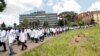 FILE - Health workers under the Kenya Medical Practitioners, Pharmacists and Dentists Union (KMPDU) demonstrate in Nairobi, Kenya, April 16, 2024.
