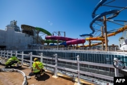 Workers are seen on the construction site of a deck on the Royal Caribbean's new ship 'Icon of the Seas' at the Turku shipyard in Finland's southwest coast, May 30, 2023.