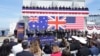 FILE - From left, Australian Prime Minister Anthony Albanese, U.S President Joe Biden and British Prime Minister Rishi Sunak speak at an AUKUS event at Point Loma naval base in San Diego, California, March 13, 2023.