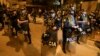 Police guard outside President Dina Boluarte's house during a raid ordered by the Attorney General's Office aimed at seizing Rolex watches as part of a preliminary investigation into alleged illicit enrichment in Lima, Peru, March 30, 2024.