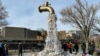 A prop depicting a water tap with cascading plastic bottles is displayed by activists near the Shaw Centre venue of penultimate negotiations for the first-ever global plastics treaty, in Ottawa, Ontario, Canada, April 23, 2024. 