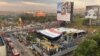 An aerial view shows a billboard that fell on a gas station following a wind and dust storm in Mumbai, India, May 13, 2024.