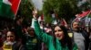 People gather in Paris to take a stand against racism, Islamophobia and violence against children, April 21, 2024. Some participants wore shirts that said "Free Palestine."