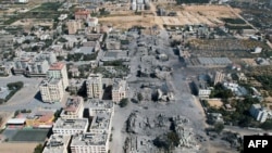 Foto dari udara yang diabadikan oleh jurnalis AFP, Belal Alsabbagh, menunjukkan gedung-gedung yang hancur di Kota al-Zahra di selatan Kota Gaza akibat serangan udara pada 20 Oktober 2023. (Foto: Belal Alsabbagh/AFP)