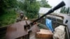 An armed pro-Russian separatist from the so-called Vostok (East) Battalion stands guard at a checkpoint in the eastern Ukrainian city of Donetsk July 8, 2014.