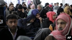 FILE - Hundred of Syrian families wait to register at the United Nations High Commissioner for Refugees (UNHCR) headquarters in Beirut, Lebanon, Jan. 30, 2017.