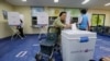 A woman casts her ballot for presidential election at a polling station in Seoul, South Korea, May 9, 2017.
