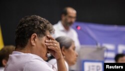 Familiares de víctimas durante una audiencia de reconocimiento, organizada por la Jurisdicción Especial para la Paz (JEP), en Ocaña, el 27 de abril de 2022.