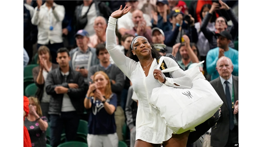 FILE - Serena Williams waves as she leaves the court after losing to France's Harmony Tan in a first round women's singles match on day two of the Wimbledon tennis championships in London, June 28, 2022.