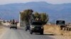 Soldiers drive through a road near Wana, the main town in Pakistan's South Waziristan tribal region bordering Afghanistan November 27, 2012. In a Pakistan army base high in the mountains on the Afghan frontier, a general explains a strategy for fighting t