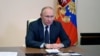 FILE - Russian President Vladimir Putin chairs a meeting with members of the Security Council via a video link at the Novo-Ogaryovo state residence outside Moscow, Russia March 3, 2022.