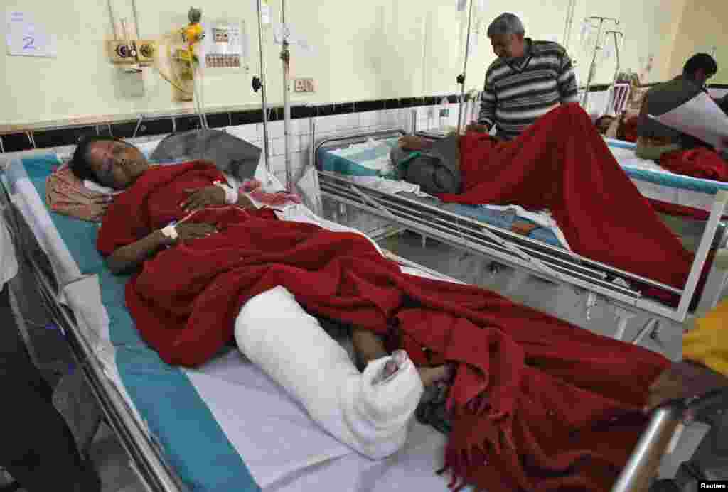 People who were injured in a stampede are treated inside a hospital in the northern Indian city of Allahabad, Feb. 11, 2013.