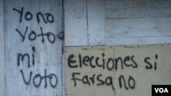 Imagen de un cartel tdonde se lee: "Yo no voto mi voto" "Elecciones sí farsa no". Tomada durante las elecciones municipales de 2017 en Nicaragua. [Foto de archivo]