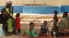 Children suffering from lead poisoning wait to see medical workers, in Gusau, Nigeria, June 9, 2010.