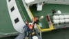 South Korea Coast Guard work to rescue survivors of the sinking ferry, Sewol, April 16, 2014. (South Korea Coast Guard)