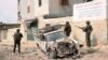Forces loyal to Syria's President Bashar al-Assad patrol at Tal-al-Zrazir neighborhood in Aleppo city September 29, 2012. 