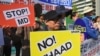 South Korean protesters hold placards during a rally against US Terminal High Altitude Area Defense (THAAD) system near the US embassy in Seoul on April 28, 2017.
