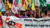 People hold a banner reading "No G7" during a demonstration in Biarritz, southwestern France, July 13, 2019. 