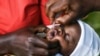 A baby receives a polio vaccine during the Malawi Polio Vaccination Campaign Launch, in Lilongwe Malawi, Sunday March 20, 2022. A drive to vaccinate more than 9 million children against polio has been launched this week in four countries in southern and e