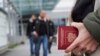 A person holds a Russian Passport at the Vaalimaa border crossing point between Russia and Finland, in Vaalimaa, Finland, Sept. 23, 2022.