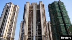FILE - Residential buildings are under construction at Evergrande Cultural Tourism City, a project developed by China Evergrande Group, in Suzhou's Taicang, Jiangsu province, China, on Sept. 23, 2021. China's housing market has been in crisis for several years.