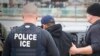 FILE - U.S. Immigration and Customs Enforcement (ICE) agents arrest foreign nationals, Feb. 7, 2017, in Los Angeles. 