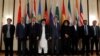 FILE - Russian Foreign Minister Sergey Lavrov (C) poses for a photo with members of delegations during multilateral peace talks on Afghanistan in Moscow, Russia, Nov. 9, 2018. 