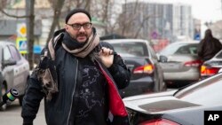 FILE - Russian theater and film director Kirill Serebrennikov walks to a court hearing in Moscow, April 12, 2019. A Moscow court dismissed the case against an acclaimed director, two years after he was accused of embezzlement and put under house arrest.