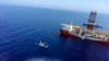 FILE - A helicopter flies near Turkey's drilling ship, Fatih, dispatched toward the eastern Mediterranean, near Cyprus, July 9, 2019.