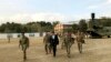 U.S. Defense Secretary Mark Esper, center, walks Gen. Scott Miller, right, chief of the U.S.-led coalition in Afghanistan, at the U.S. military headquarters in Kabul, Oct. 20, 2019. 