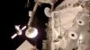 A NASA image taken from video shows the Russian Soyuz spacecraft (L), ferrying three crew members, approaching the International Space Station, March 27, 2014.