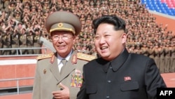 FILE - The man pictured on the left has been identified by South Korea media as Ri Yong-Gil, chief of the Korean People's Army (KPA) General Staff. South Korean media reported on Feb. 10, 2016, as that Ri Yong-Gil was executed, in what would amount to the