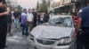 Emergency service personnel and residents gather at the site of an Israeli strike in Syria's capital Damascus on Oct. 2, 2024. 