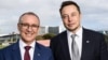 A handout photo taken and received on July 7, 2017, shows South Australia's Premier Jay Weatherill (L) and Tesla Motors CEO Elon Musk (R) at an announcement in Adelaide. AFP photo /South Australia Department of Premier and Cabinet.