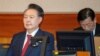 FILE - South Korea's impeached President Yoon Suk Yeol attends the hearing of his impeachment trial over his short-lived imposition of martial law, at the Constitutional Court in Seoul, Feb. 20, 2025. 