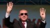 Turkey's President Recep Tayyip Erdogan salutes supporters during a rally in Malatya, Turkey, Sept. 8, 2019. 
