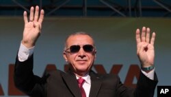 Turkey's President Recep Tayyip Erdogan salutes supporters during a rally in Malatya, Turkey, Sept. 8, 2019. 