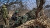 Ukrainian service members fire a 120 mm mortar toward Russian troops near the town of Bakhmut in the Donetsk region of Ukraine on March 8, 2024.
